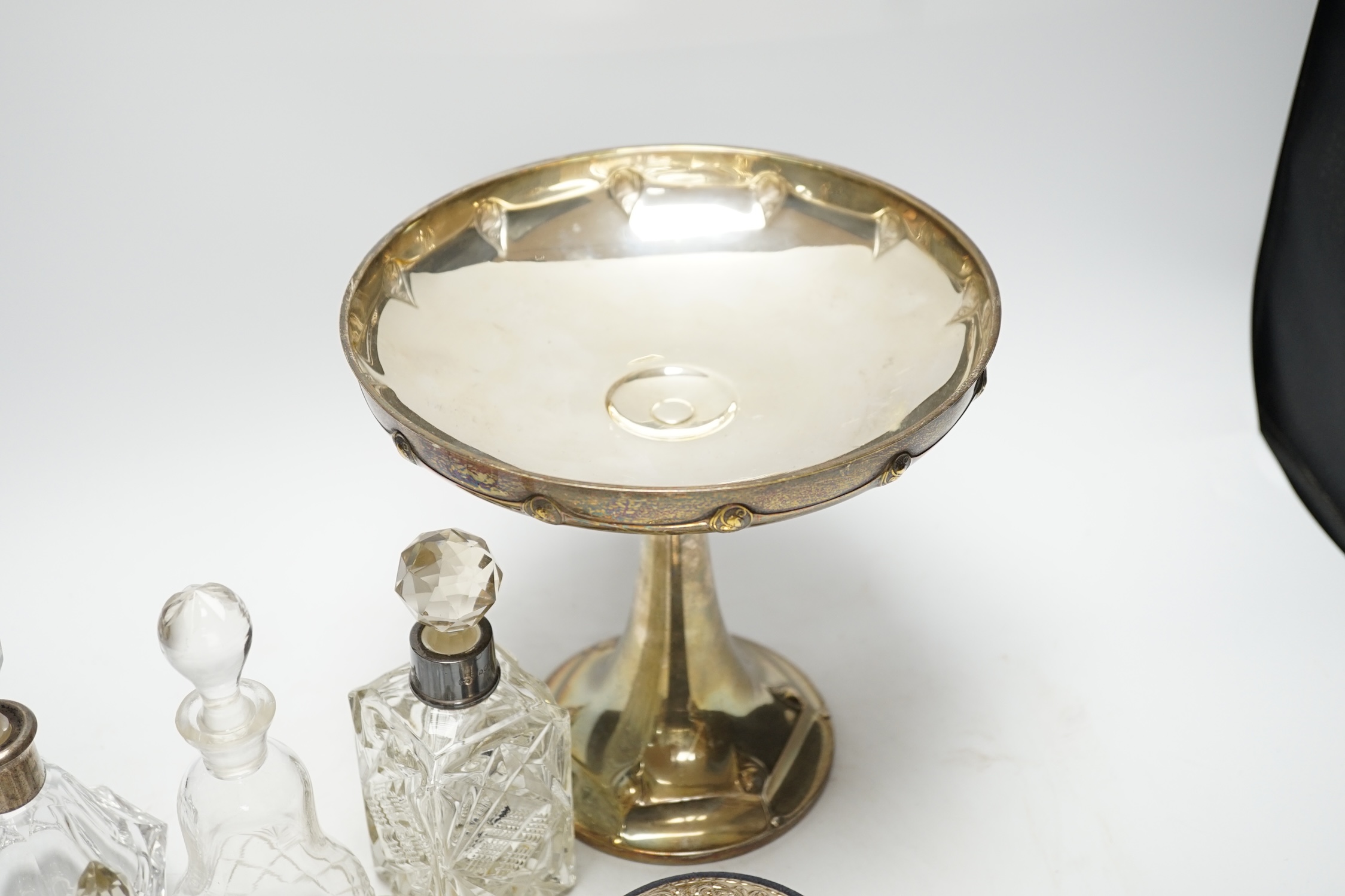 A WMF tazza, 21cm high, and five bottles, two with silver collars, and a cylindrical box